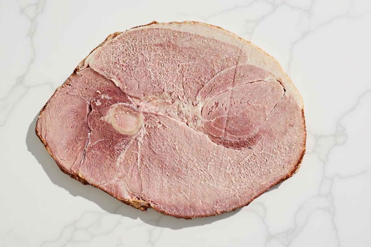 21-day dry-aged Bone-In Ham Steak on white marble